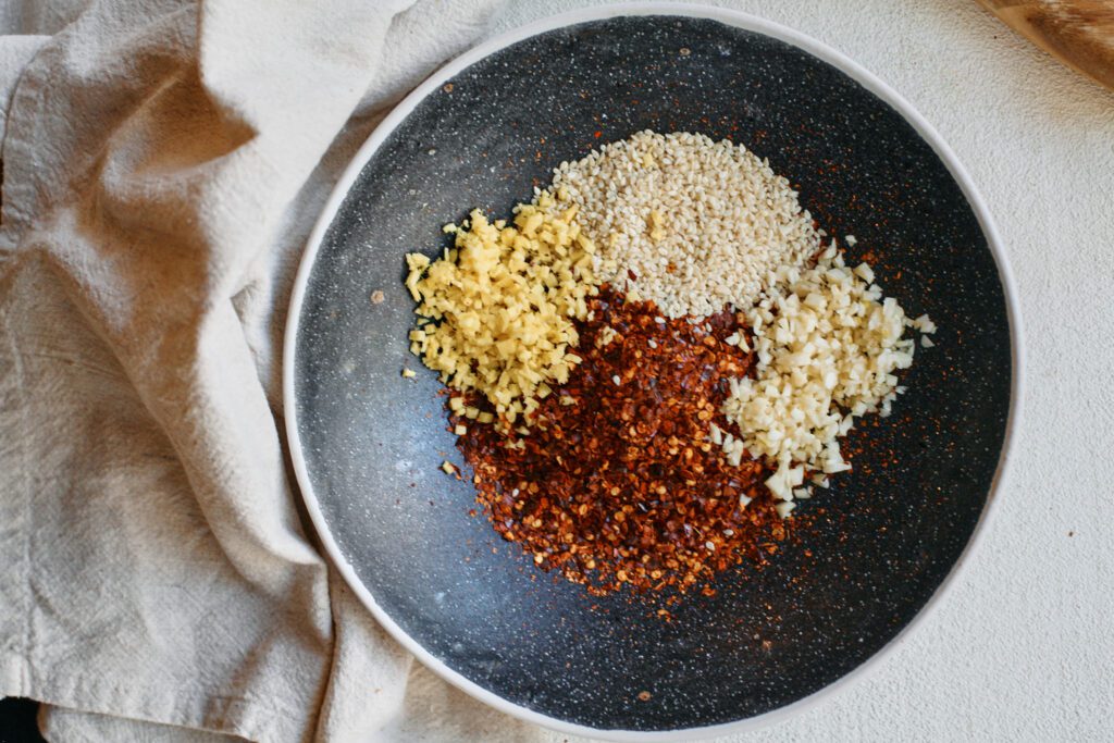 Aunt Lily’s Chili Oil 5 red chili flakes, sesame seeds, minced garlic and ginger