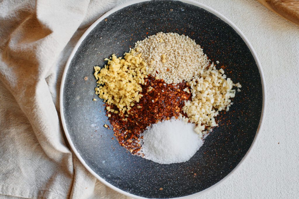 Aunt Lily’s Chili Oil 6 red chili flakes, sesame seeds and minced garlic, ginger and sugar
