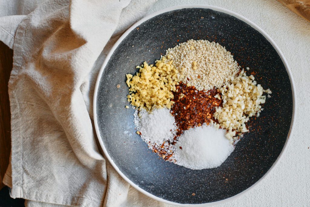Aunt Lily’s Chili Oil 7 red chili flakes, sesame seeds and minced garlic, ginger, sugar and salt