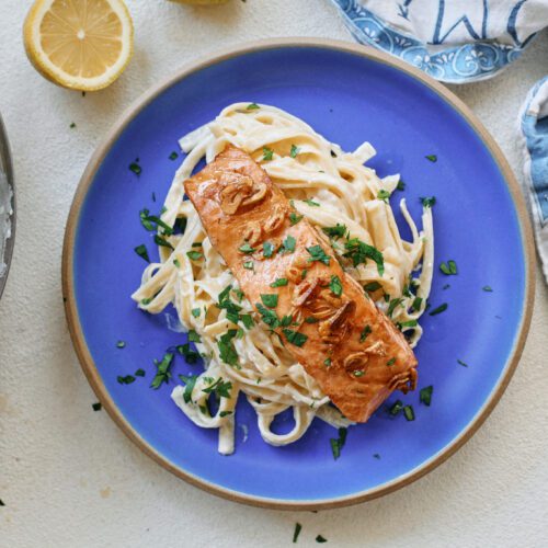 garlic butter salmon over creamy lemon pasta