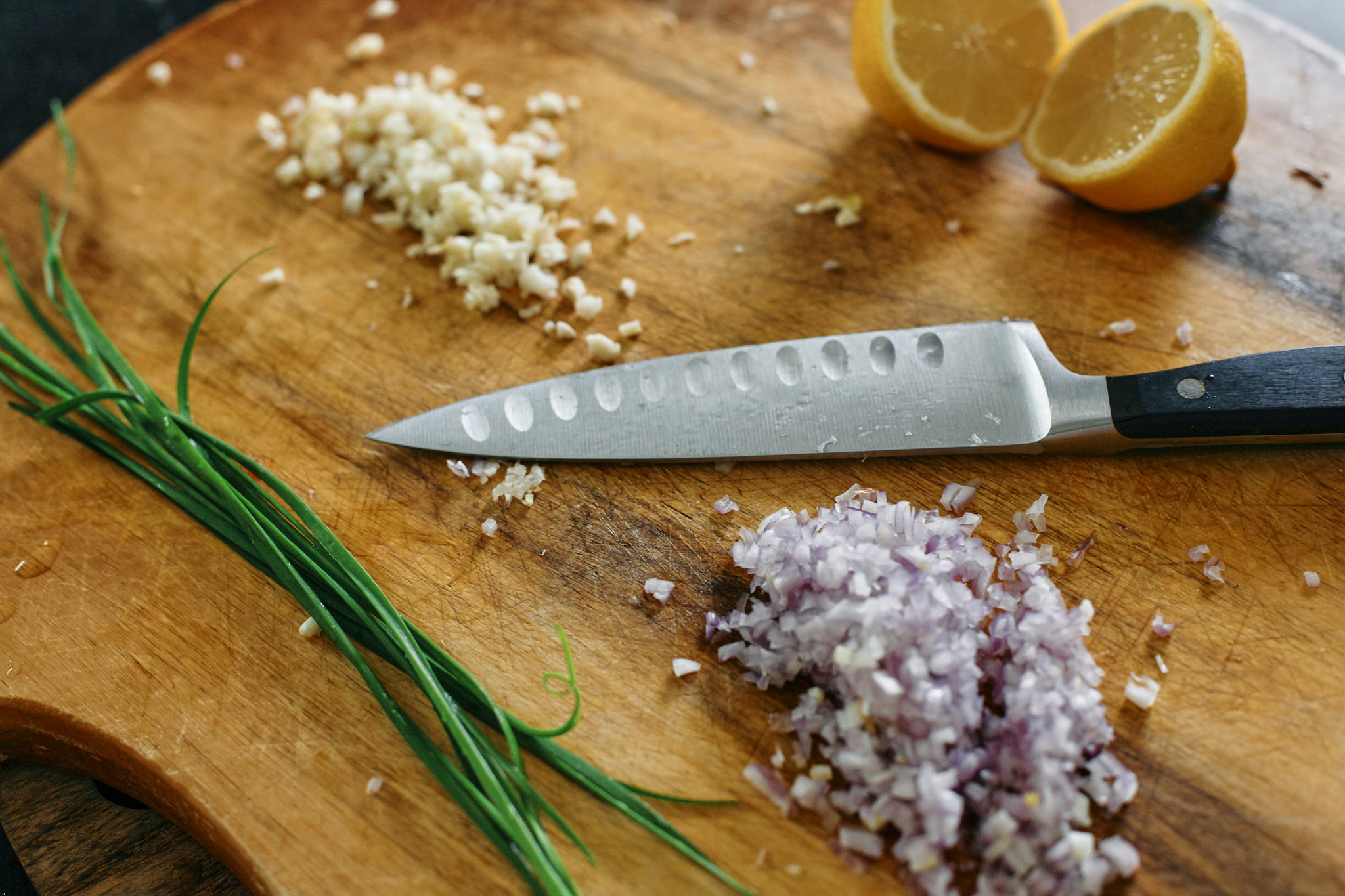 prep for the chardonnay chicken: finely minced shallots, garlic, lemon and chives for garnish
