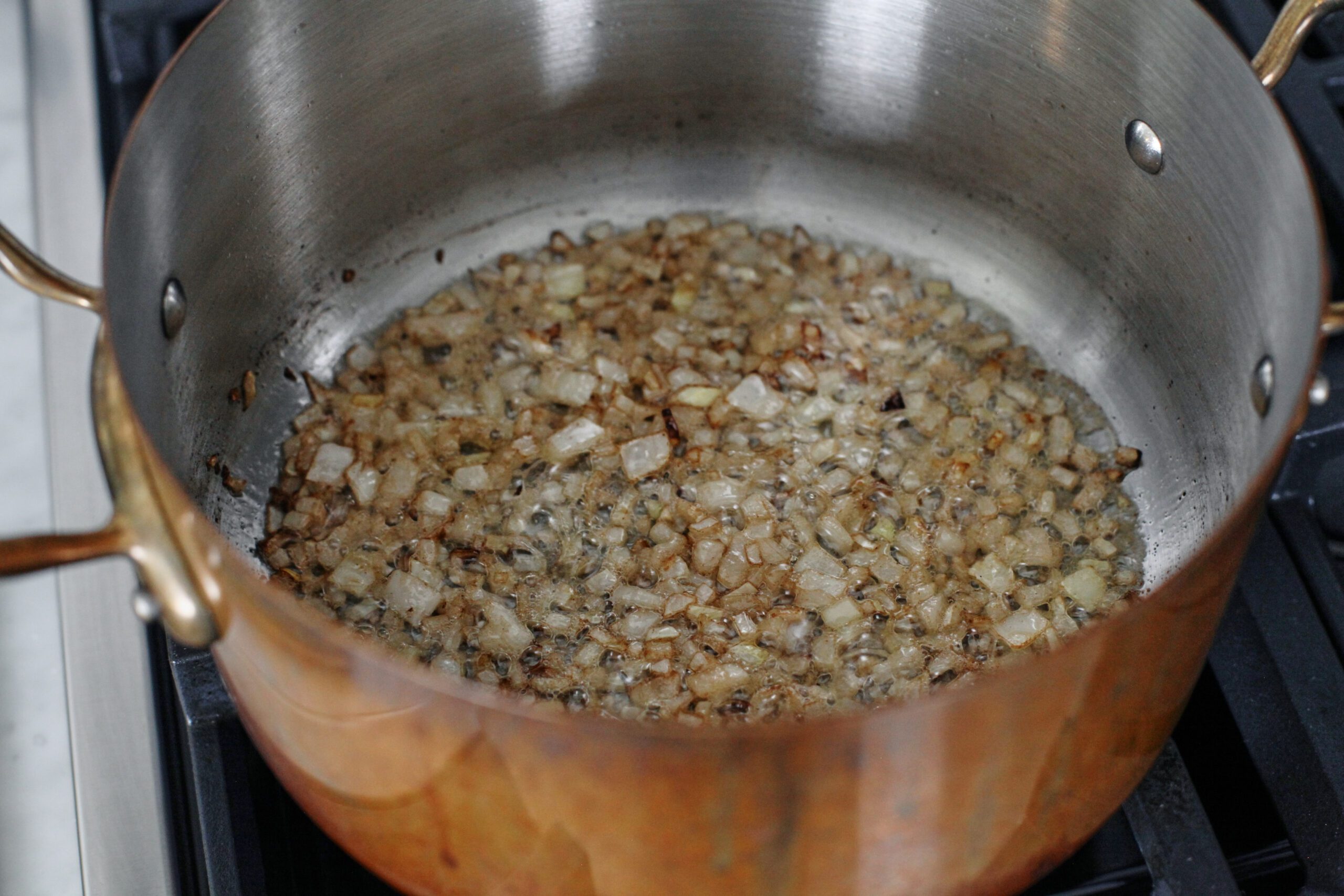 chopped onion sauteeing in a large pot