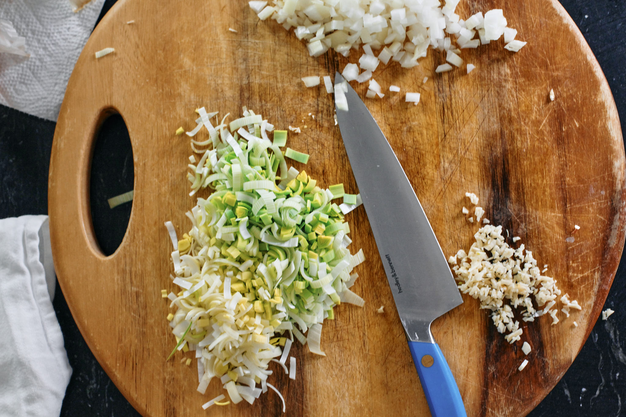 Creamy Tuscan Tortellini Bake prep for creamy tuscan tortellini bake - chopped leek, onion and garlic