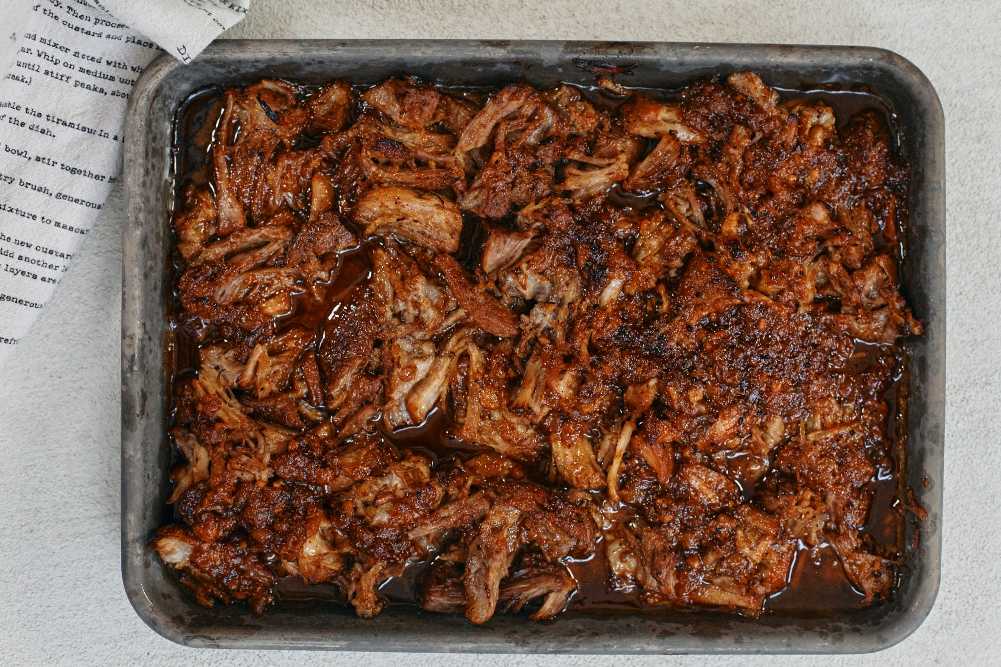 shredded citrus braised pork with glaze finished under the broiler