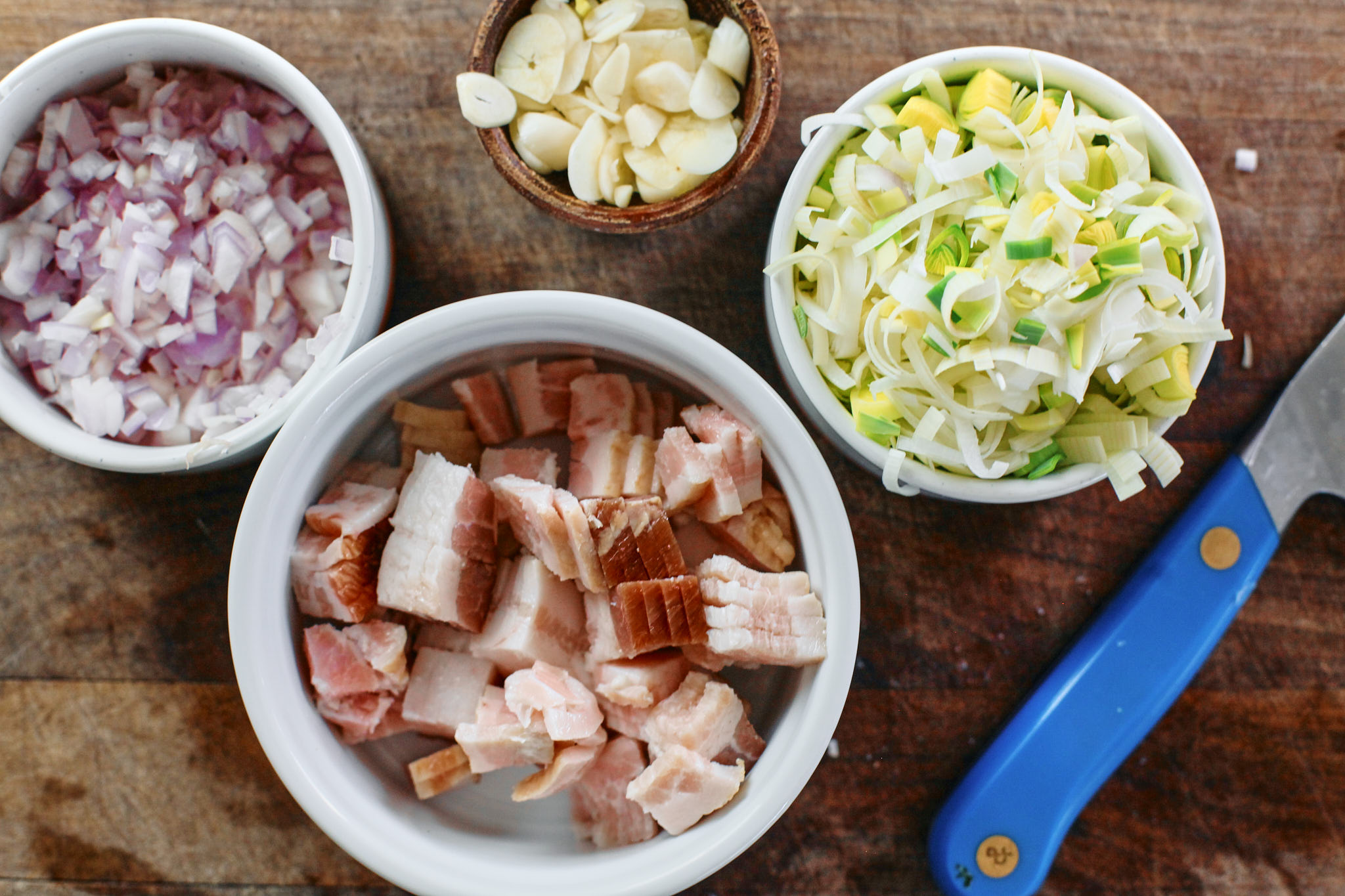 Toasted Orzo Potato Leek Soup prep for the toasted orzo potato leek soup - chopped shallot, leek, garlic and bacon.