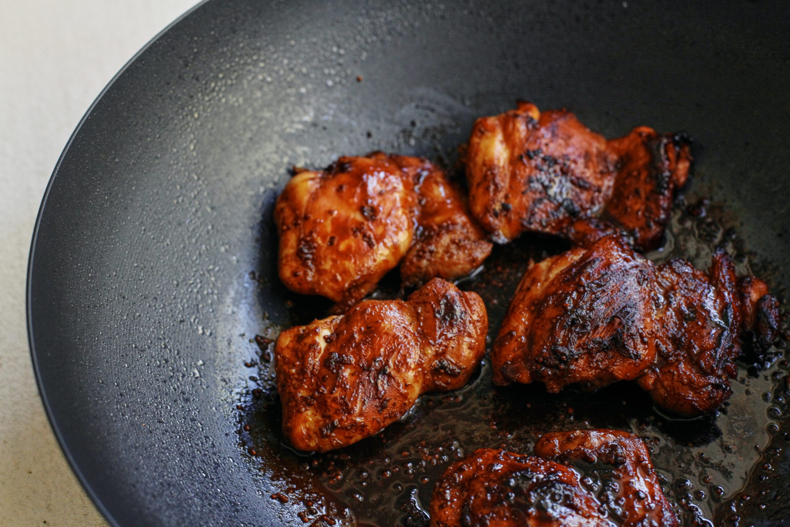 sticky sesame dijon chicken over rice with a cucumber salad sticky sesame dijon chicken