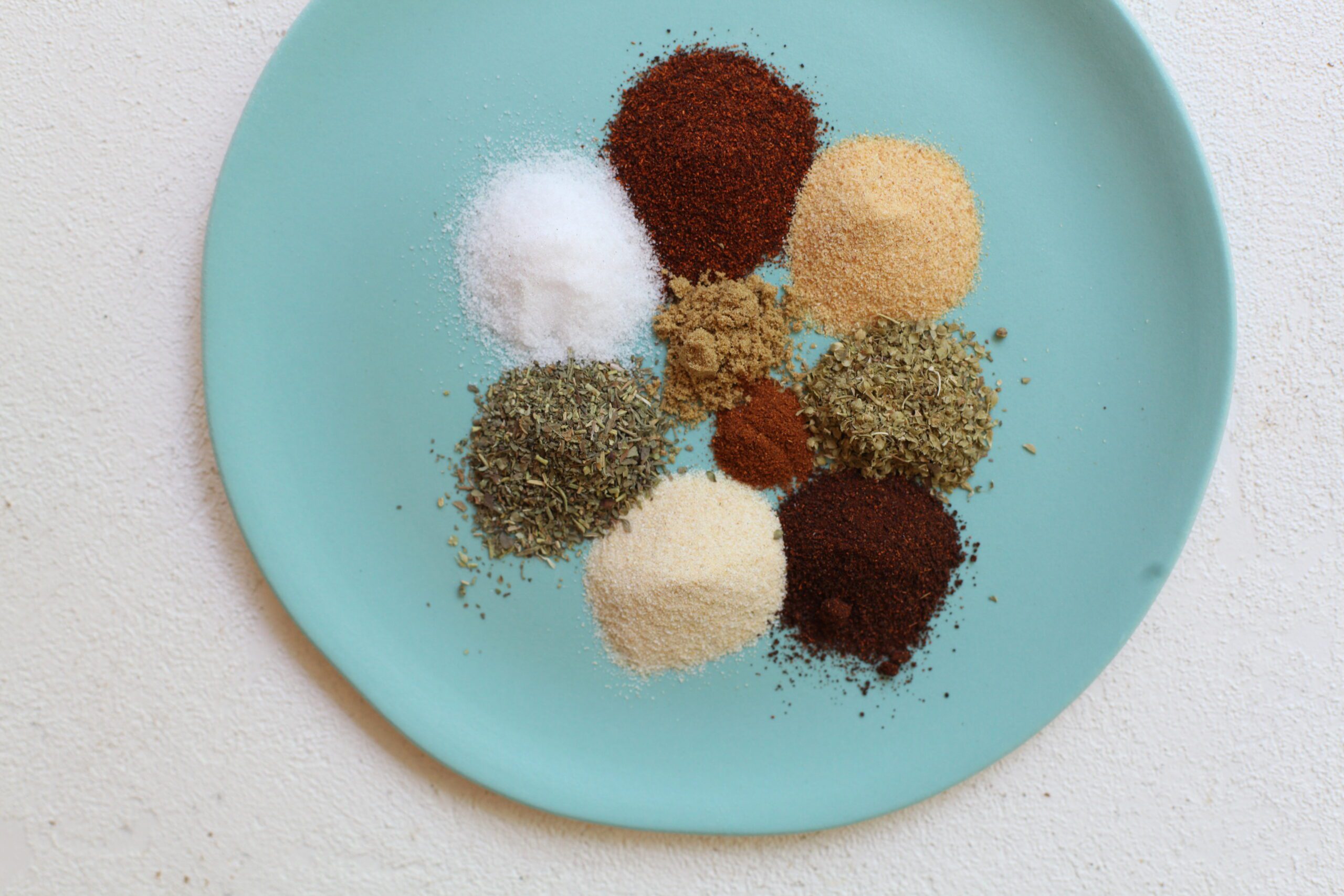 spices measured out for the chicken