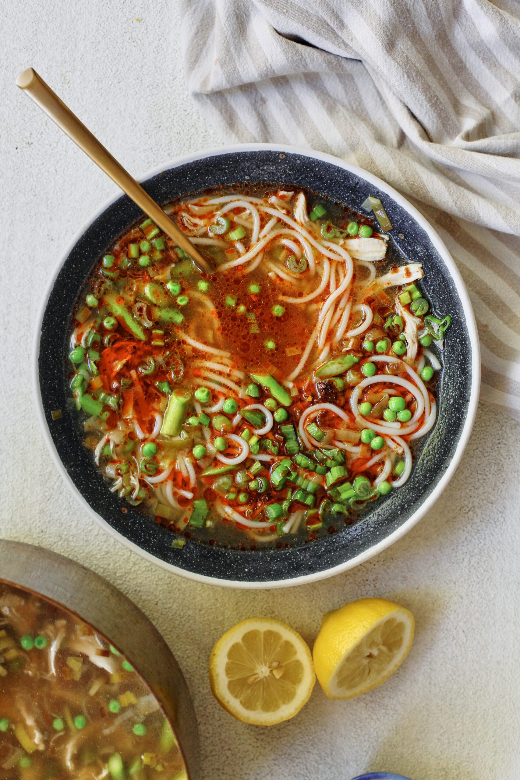 spring ginger chicken noodle soup with aunt lily's chili oil on top
