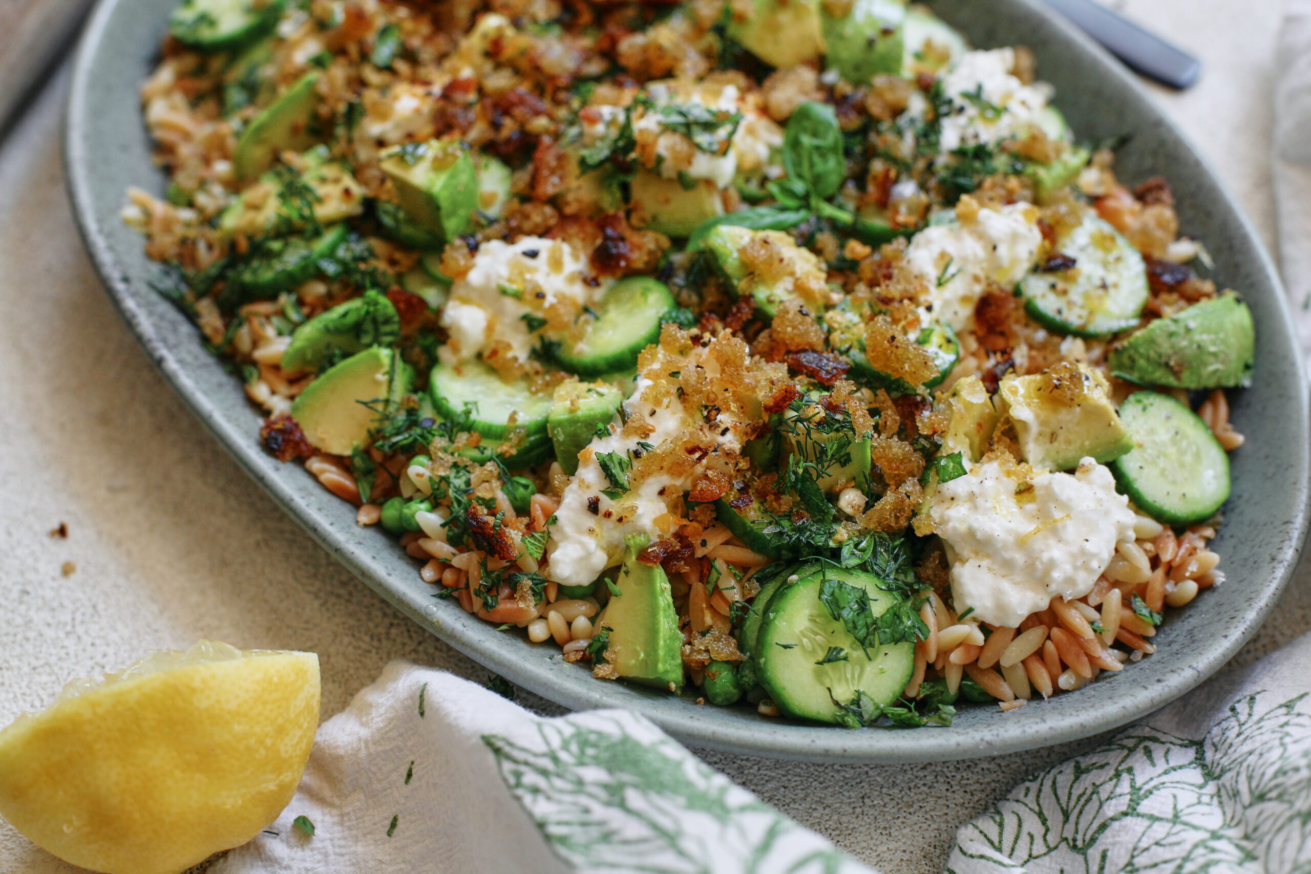 toasted orzo pasta salad with greens, burrata and garlic breadcrumbs