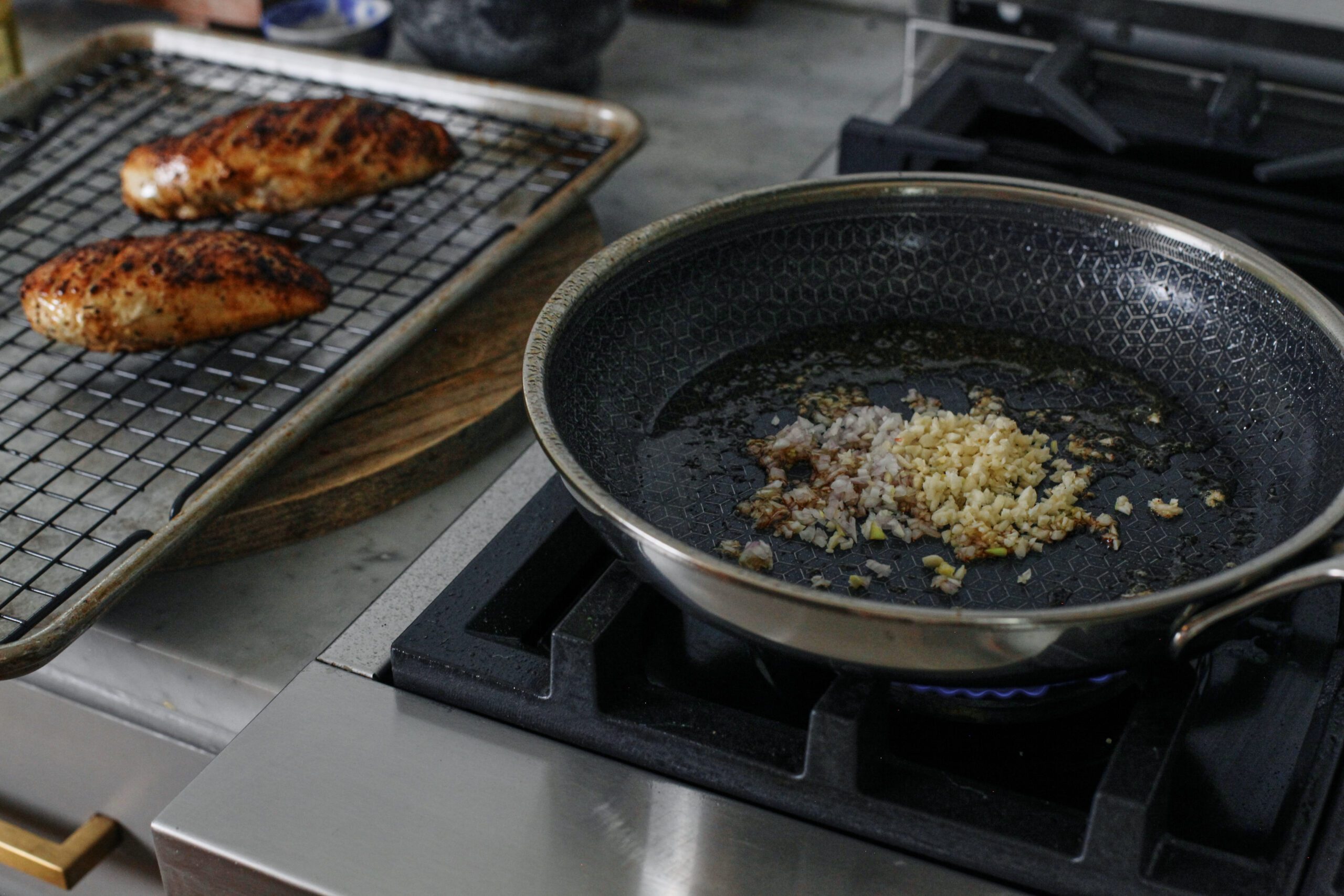 minced shallot and garlic sautéing in the pan