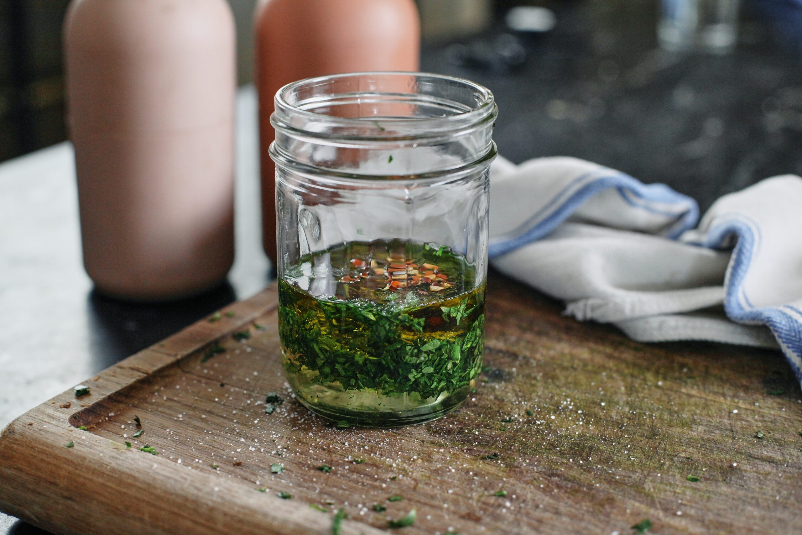 Salt and Vinegar Cauliflower 5 dressing assembled in a glass jar on a cutting board