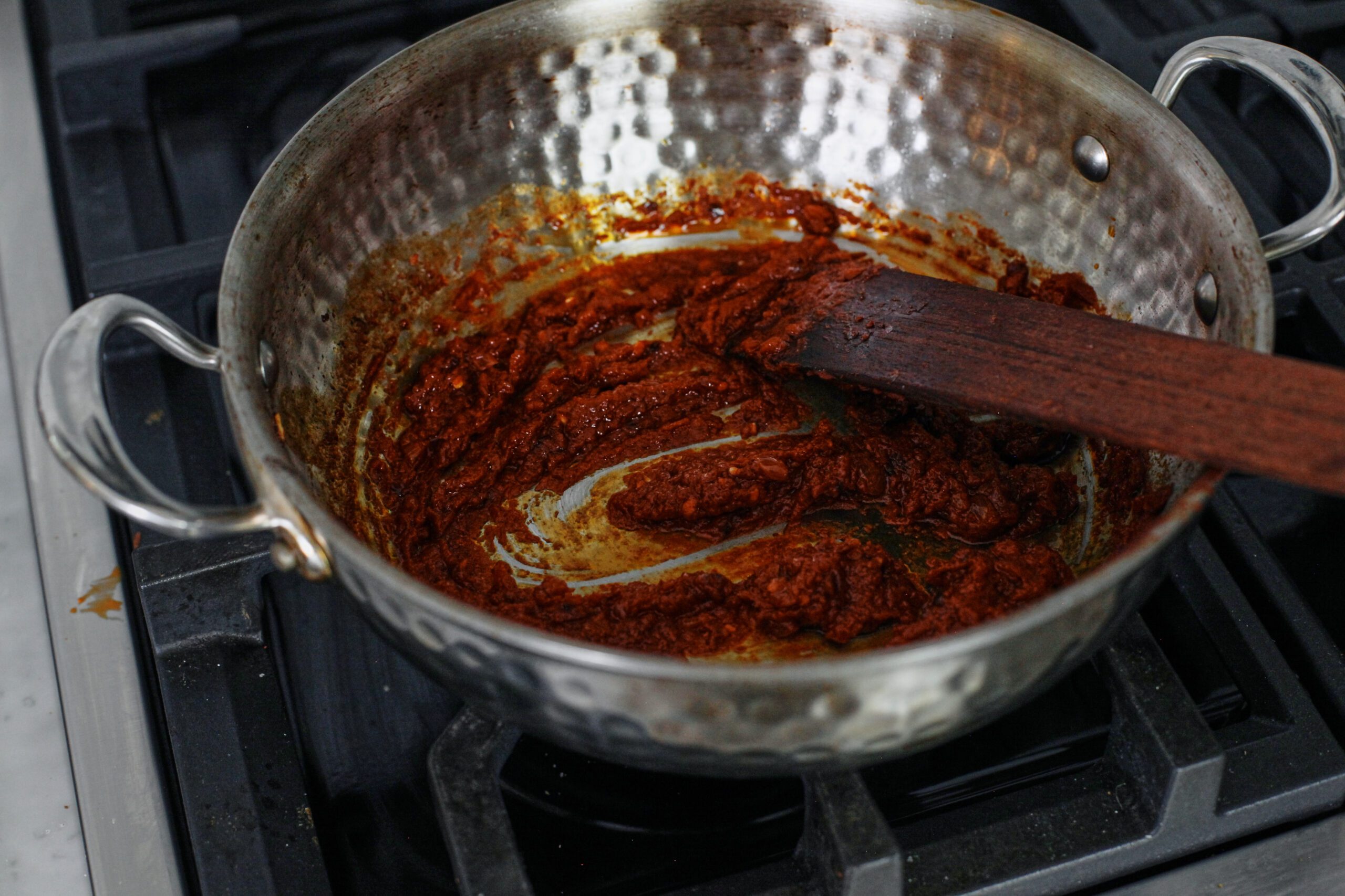 chili oil penne alla vodka 10 tomato paste and chili oil being cooked in a pan