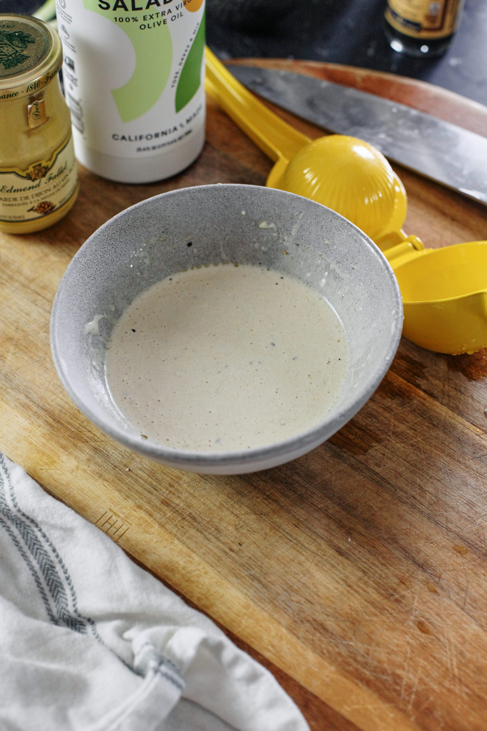 caesar dressing in a grey bowl