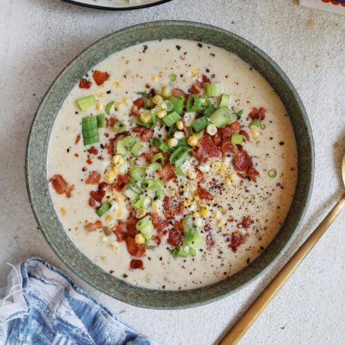creamy corn chowder topped with green onions, bacon, and black pepper
