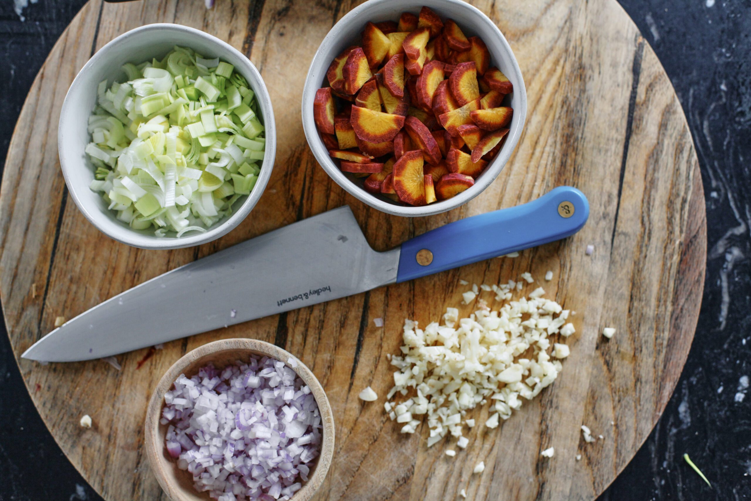 prep for the coq au vin blanc: chopped leek, carrots, shallot and garlic