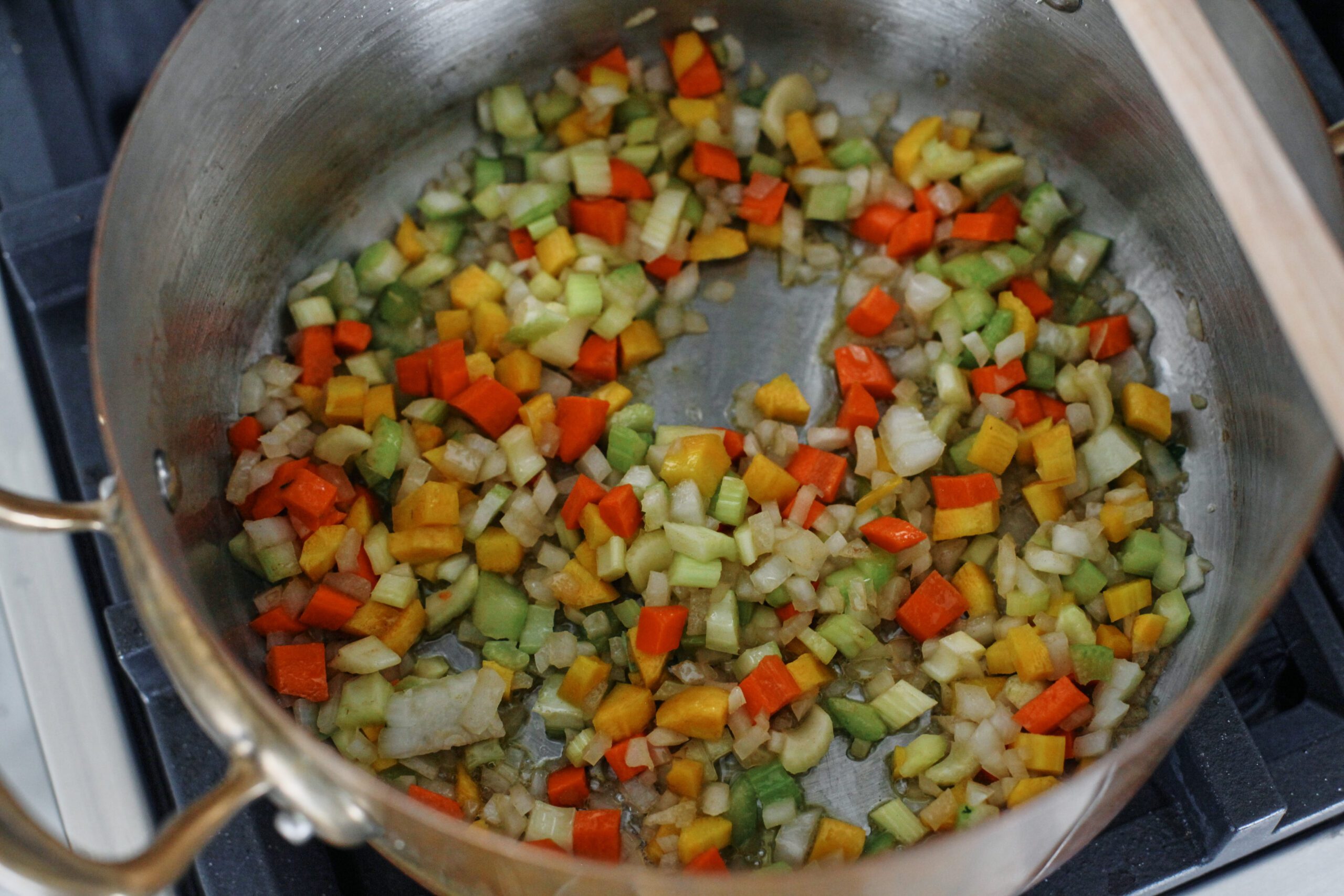 carrot, celery, onion sauteeing in a pot