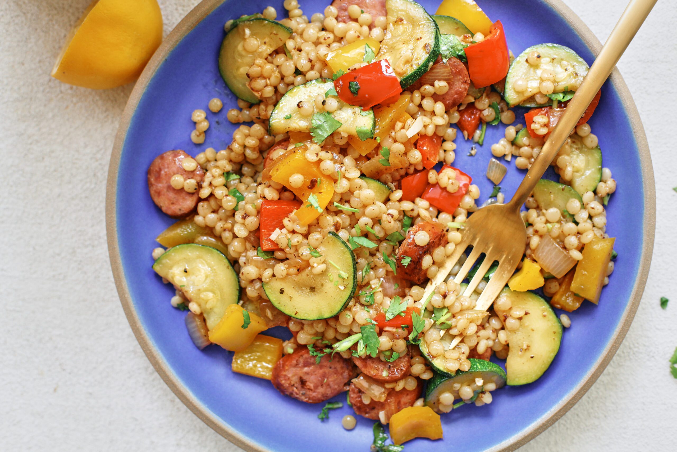 hatch chile sausage and veggie skillet served on a blue plate