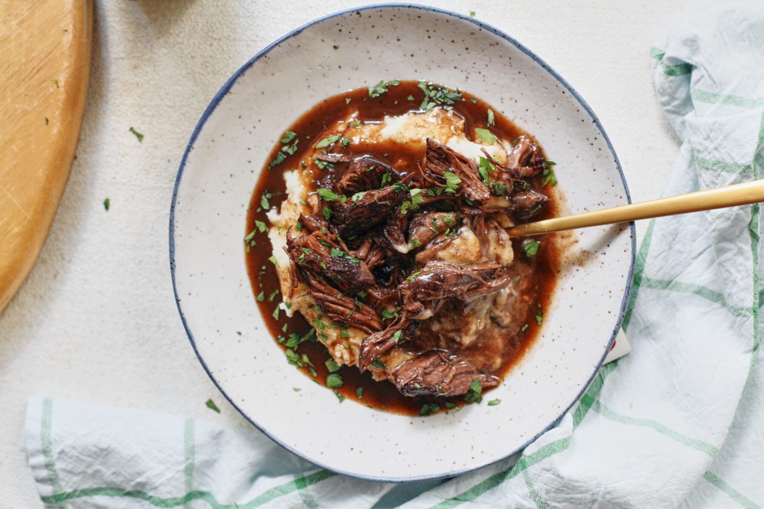 braised beef over mashed potatoes