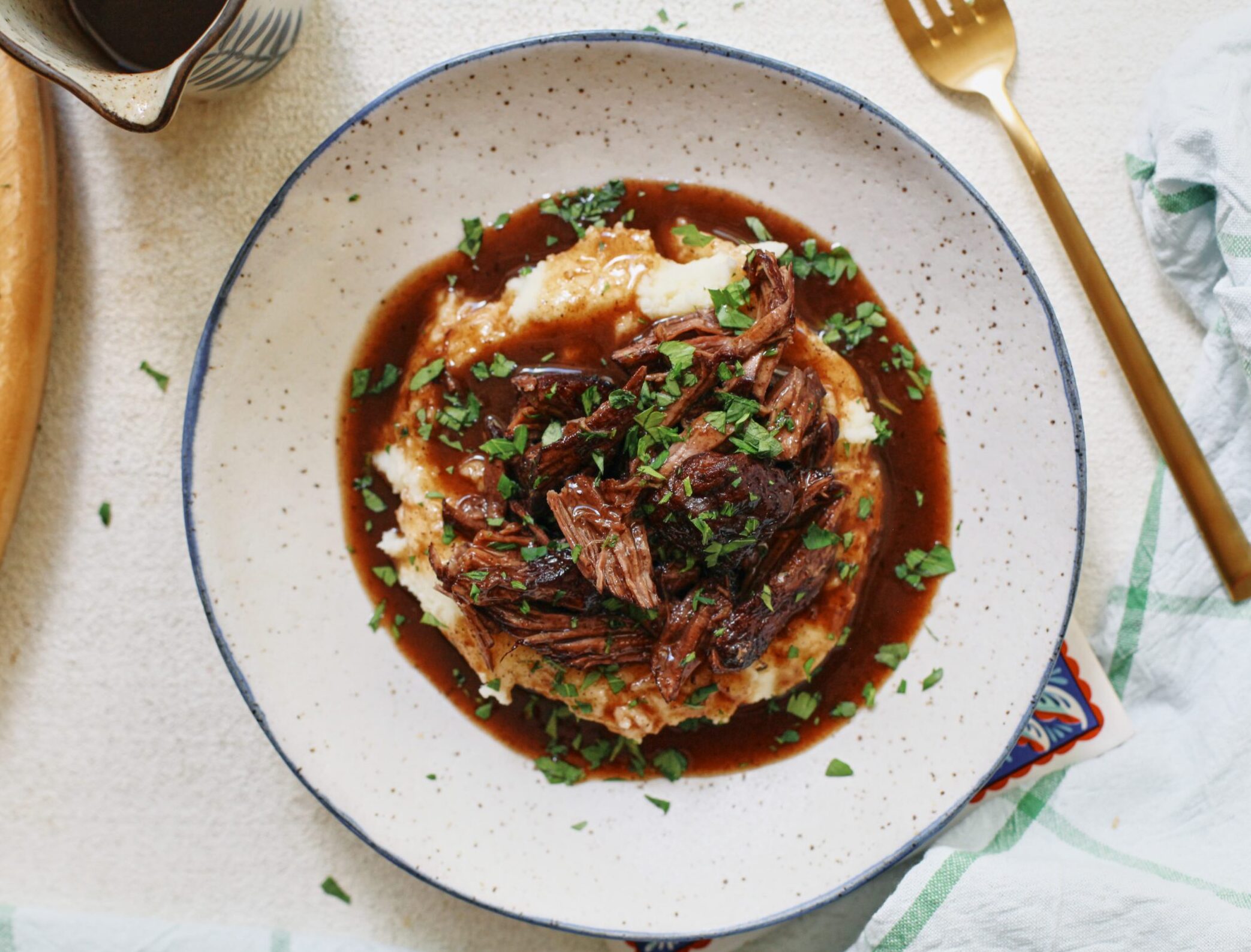 braised beef over mashed potatoes