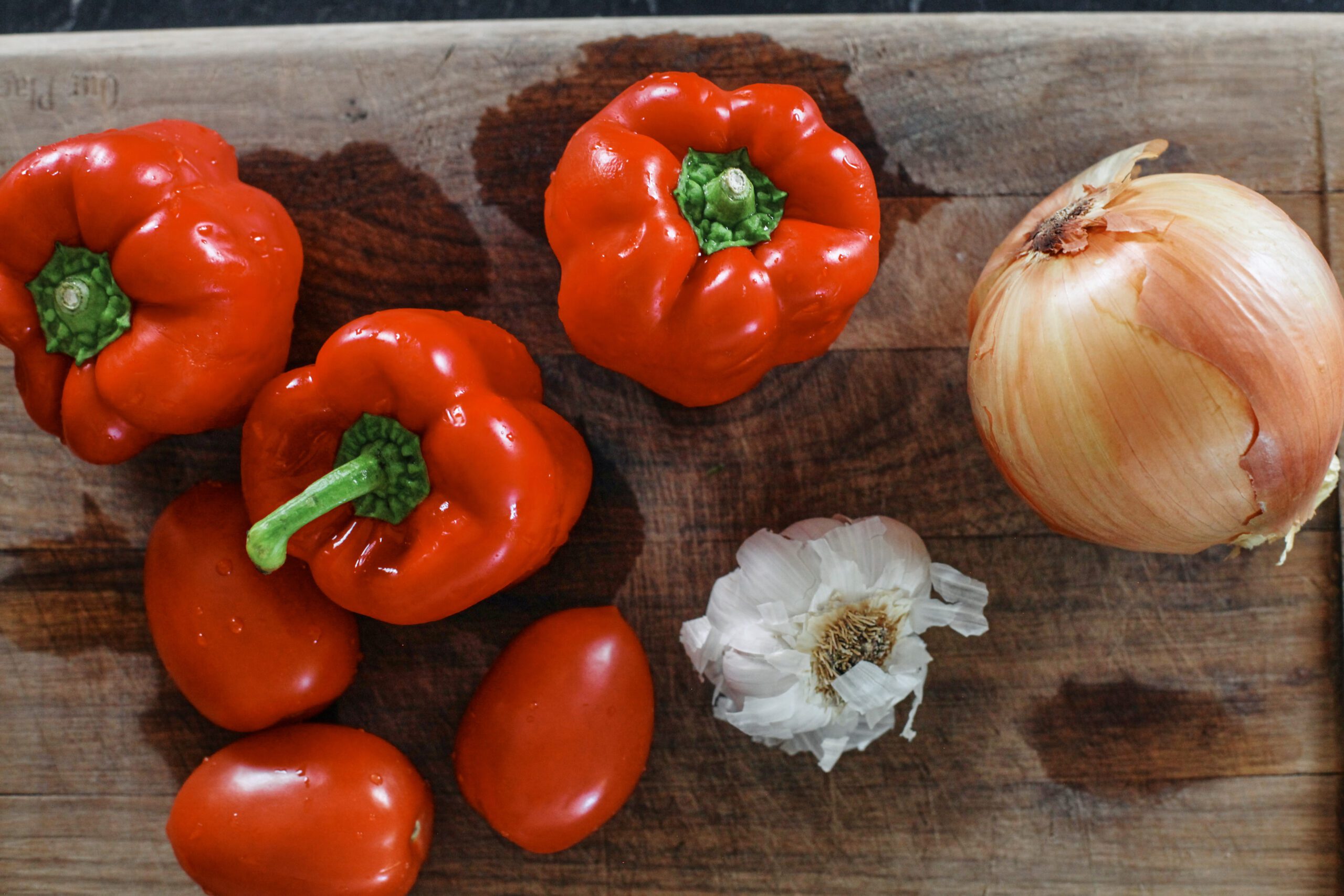 Roasted Red Pepper White Bean Soup 3 red bell peppers, 3 toamtoes, a head of garlic, and an onion