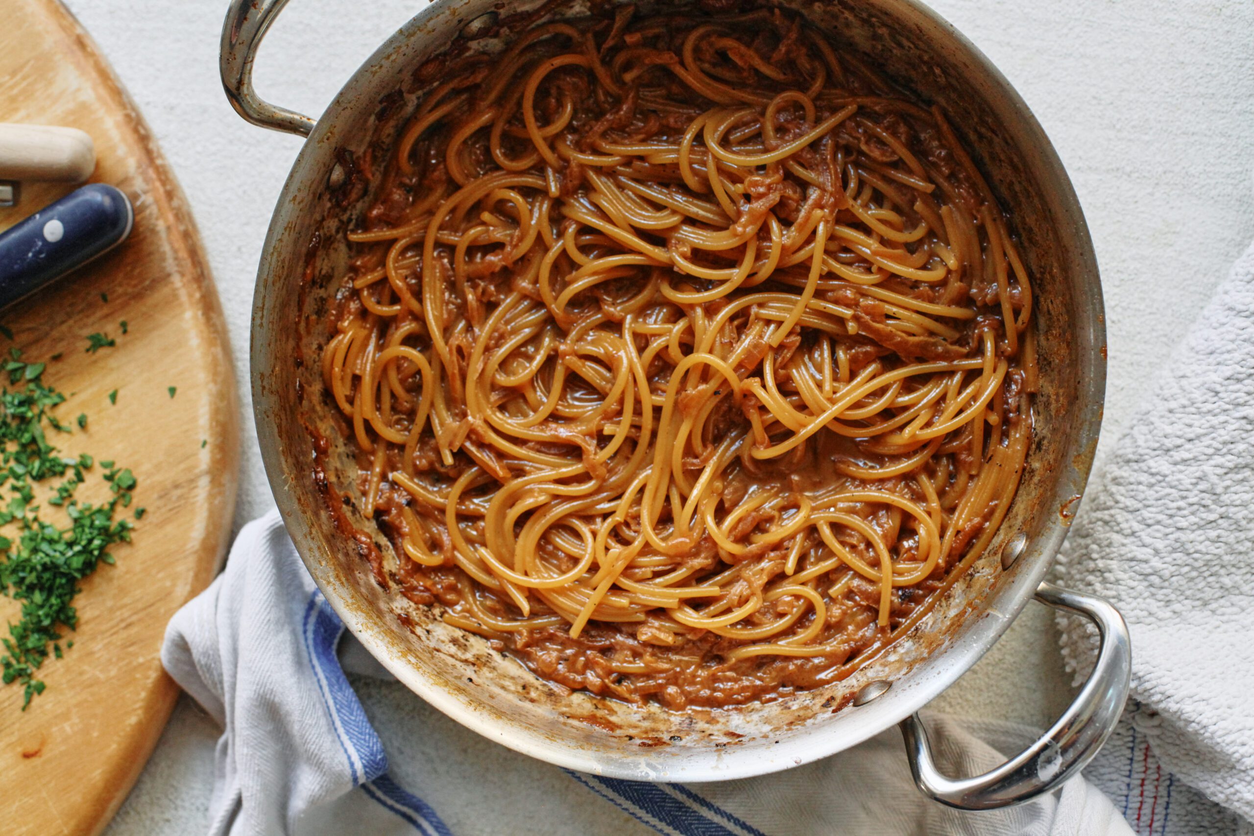 French onion spaghetti in a hammered steel pan